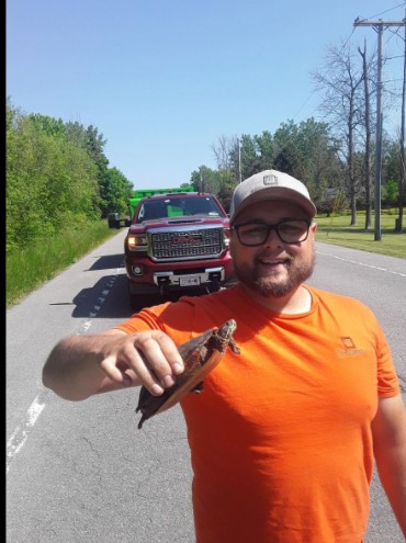 Kenny Jordan and Steve Frazer with work truck on way to job site